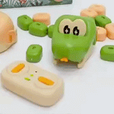 Two kids remote control magnetic snake toys slithering on a glowing game board for parent-child interactive play